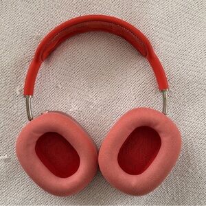 Apple AirPods Max wireless over-ear headphones in a red/pink